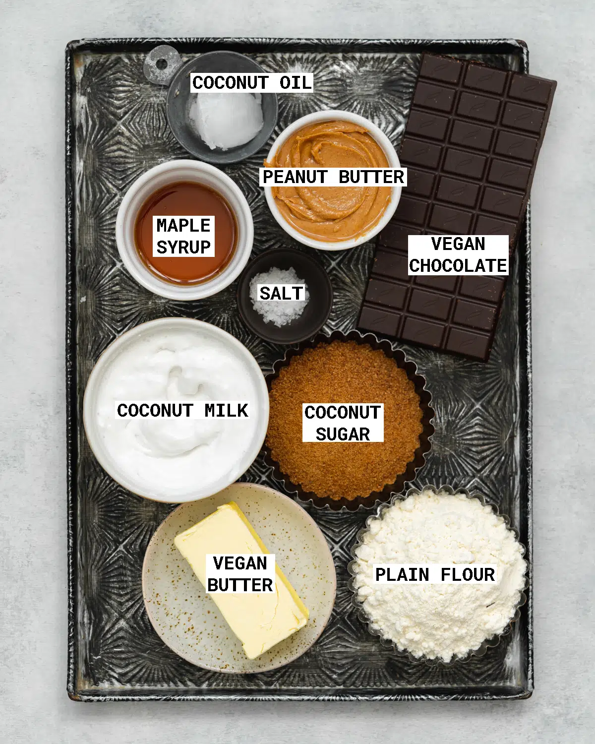vintage metal tray with ingredients to make vegan peanut butter chocolate tart.