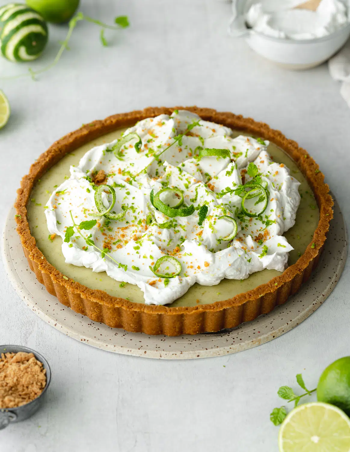 vegan key lime pie with gingernut crust and coconut cream topping.