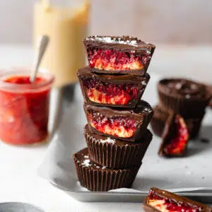 stack of peanut butter jelly filled chocolate cups.