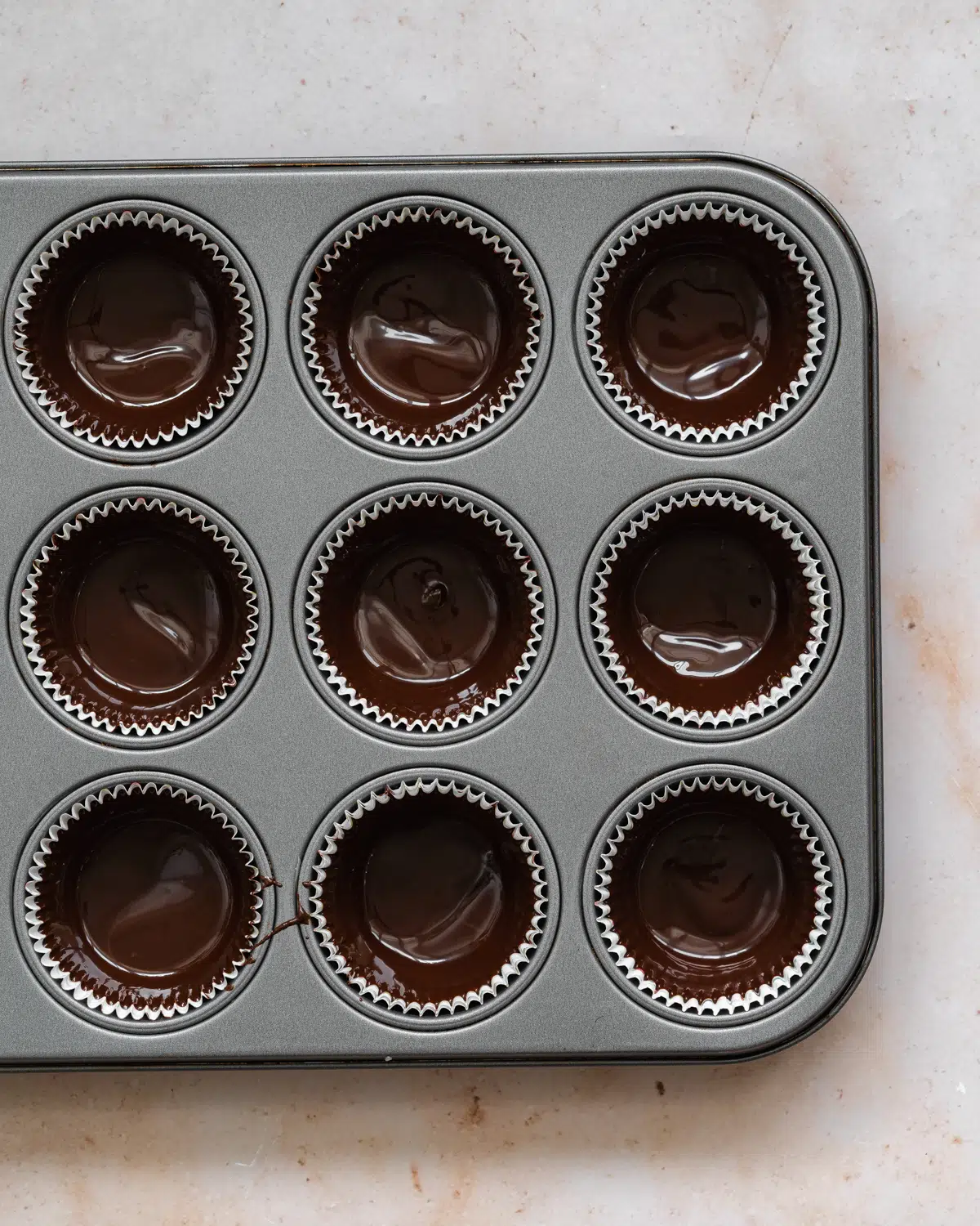 peanut butter chocolate cups in a muffin tray.