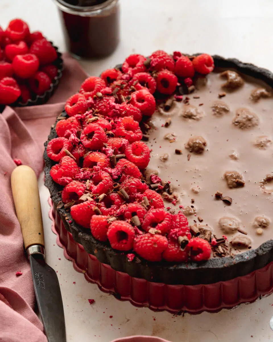 chocolate tart with raspberries on top.
