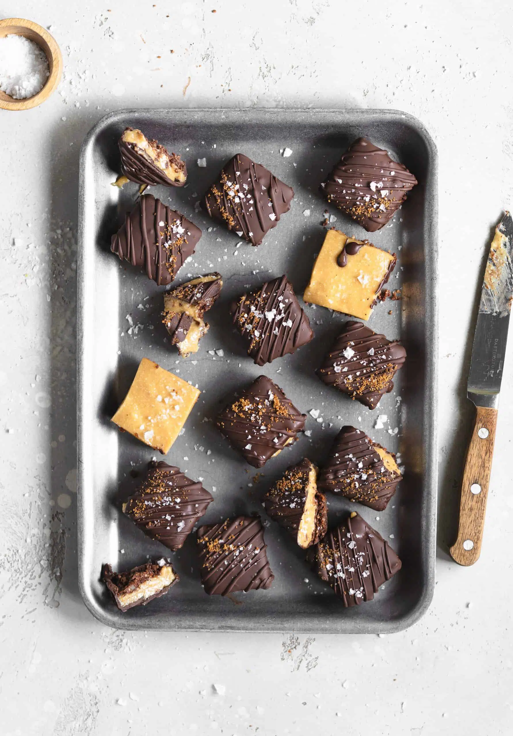 Salted caramel brownie bites on silver tray