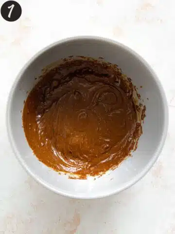 brown sugar, molasses and cashew butter blended up in a grey bowl.
