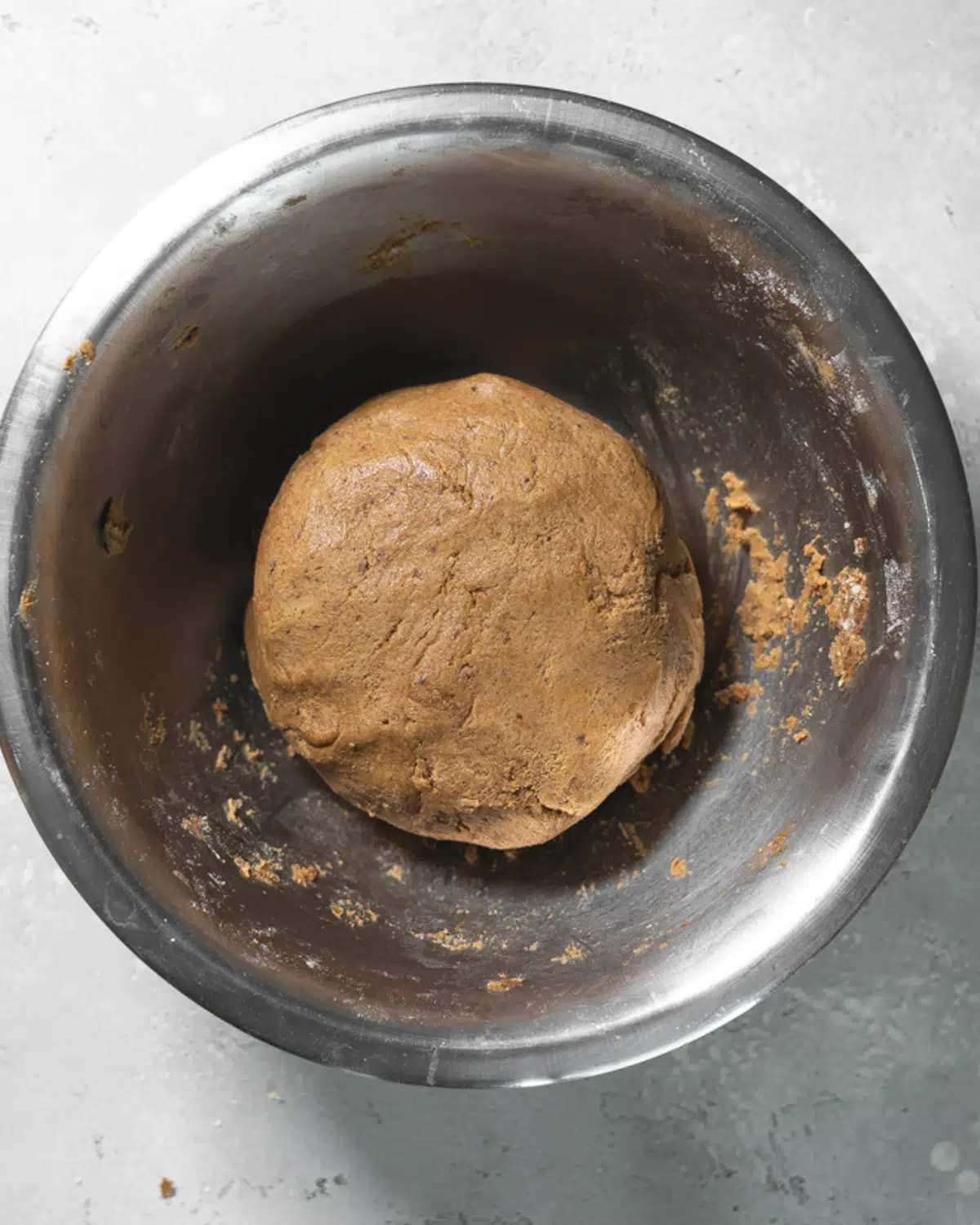 ball of gingerbread dough in a bowl.