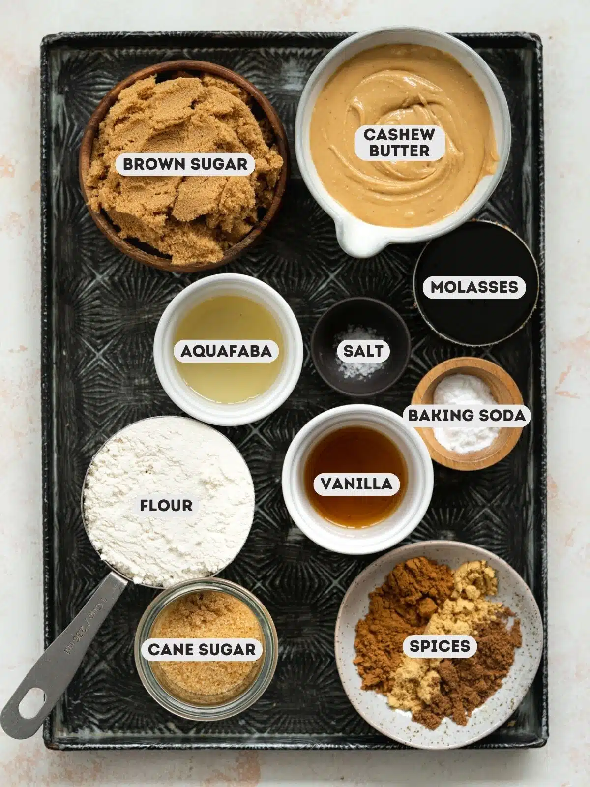 ingredients on a tray for making ginger molasses cookies.