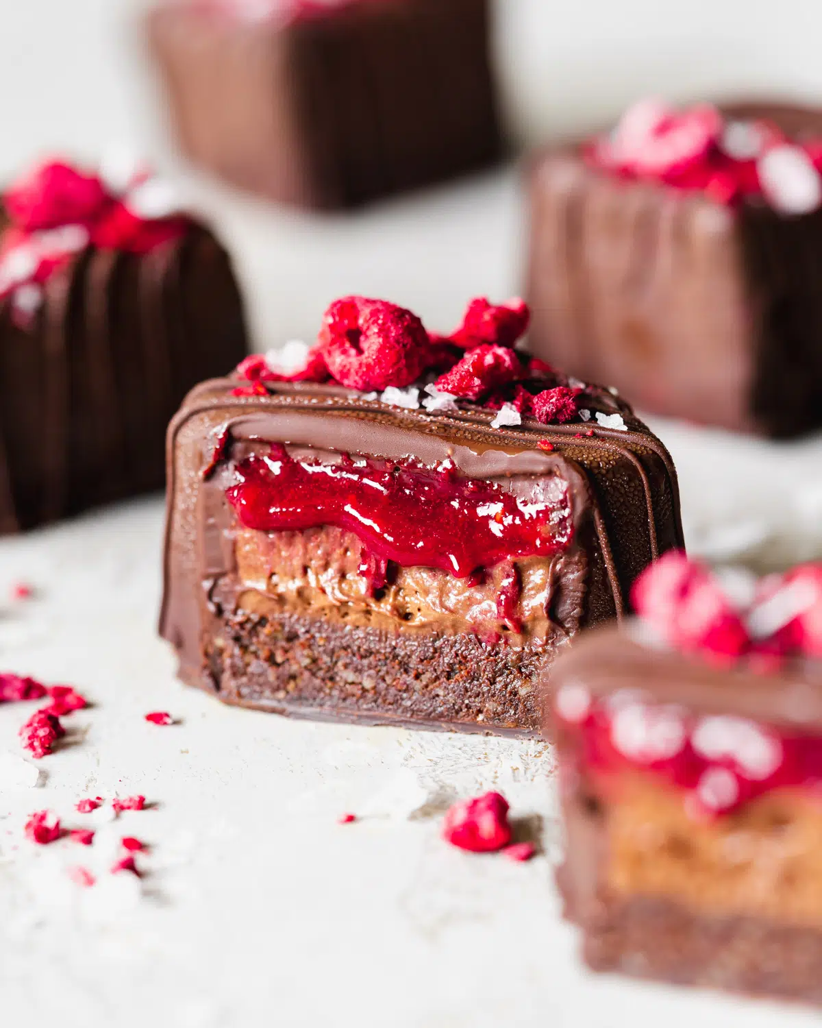 chocolate covered brownie with chocolate mousse and raspberry jam center.