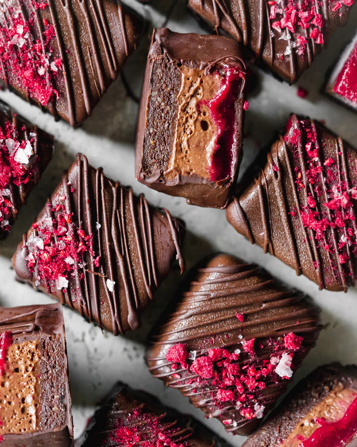 chocolate covered raspberry brownies with mousse centers.