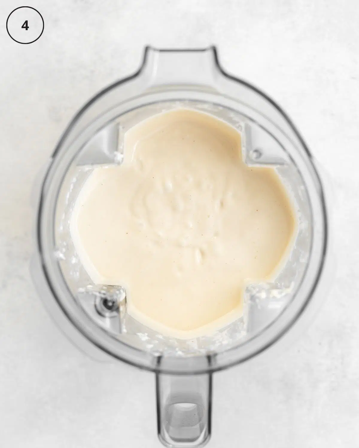 top down view of blender with cheesecake filling.