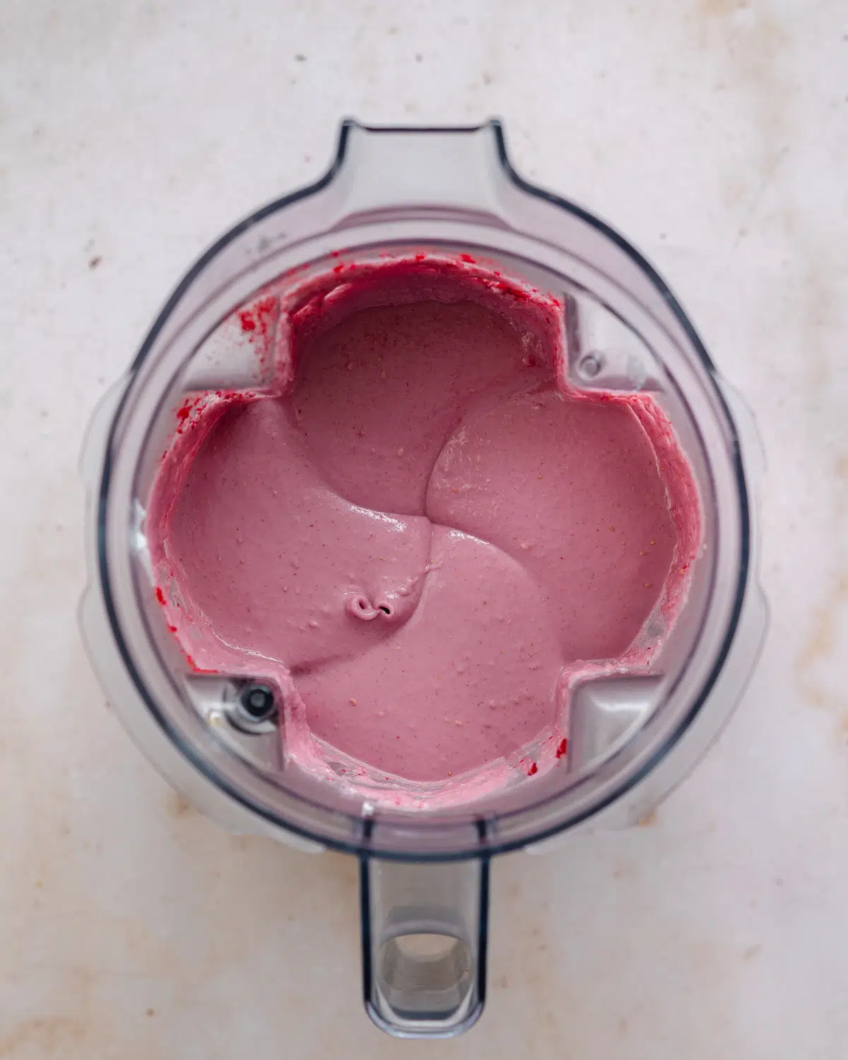raspberry cheesecake filling in a blender jug.