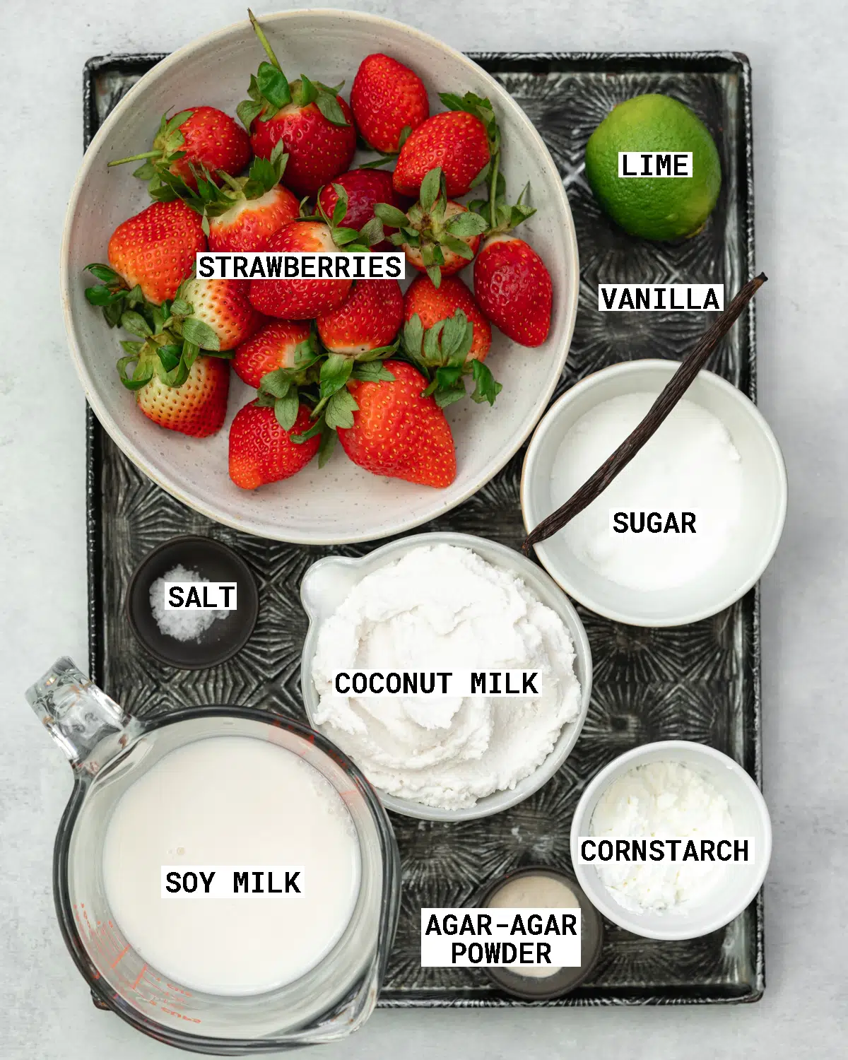 ingredients to make dairy free panna cotta on a metal tray.