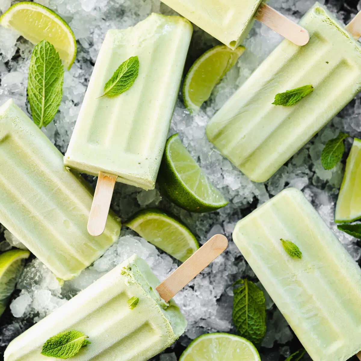 flat lay of lime popsicles on ice.