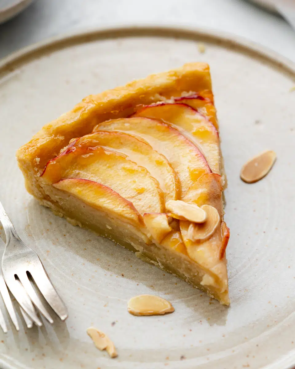 slice of apple tart with apricot glaze.