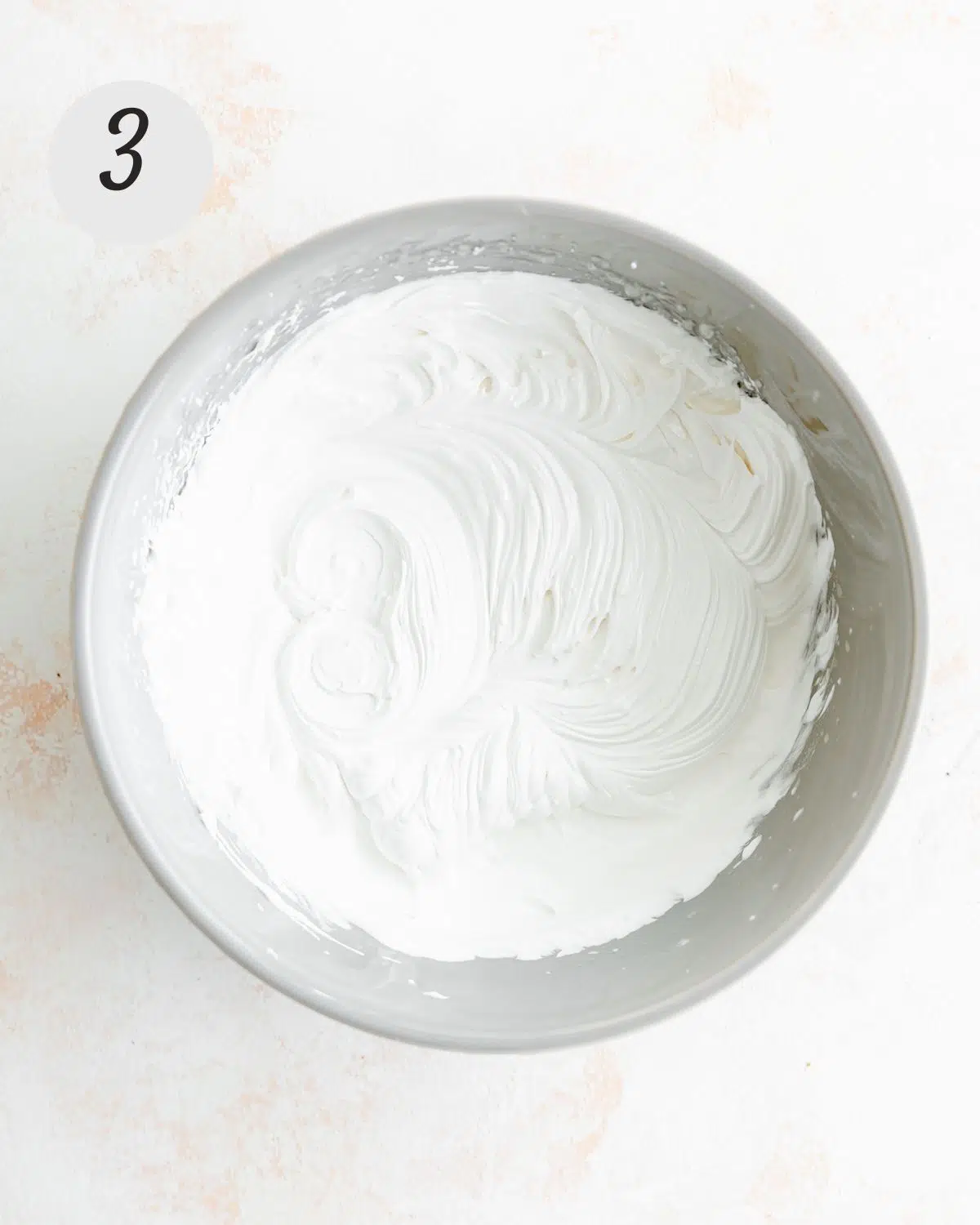whipped aquafaba in a bowl.