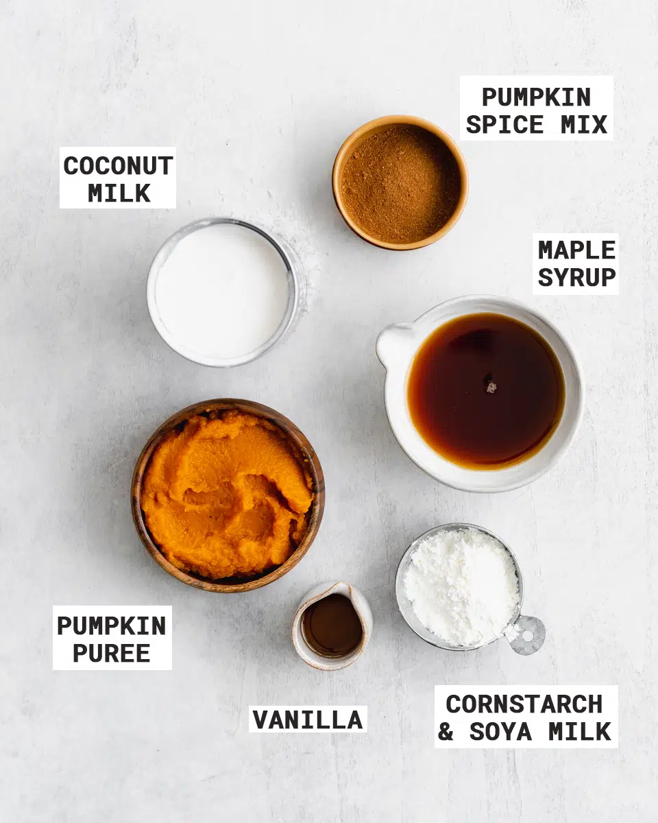 ingredients for vegan pumpkin pie measured out in bowls.