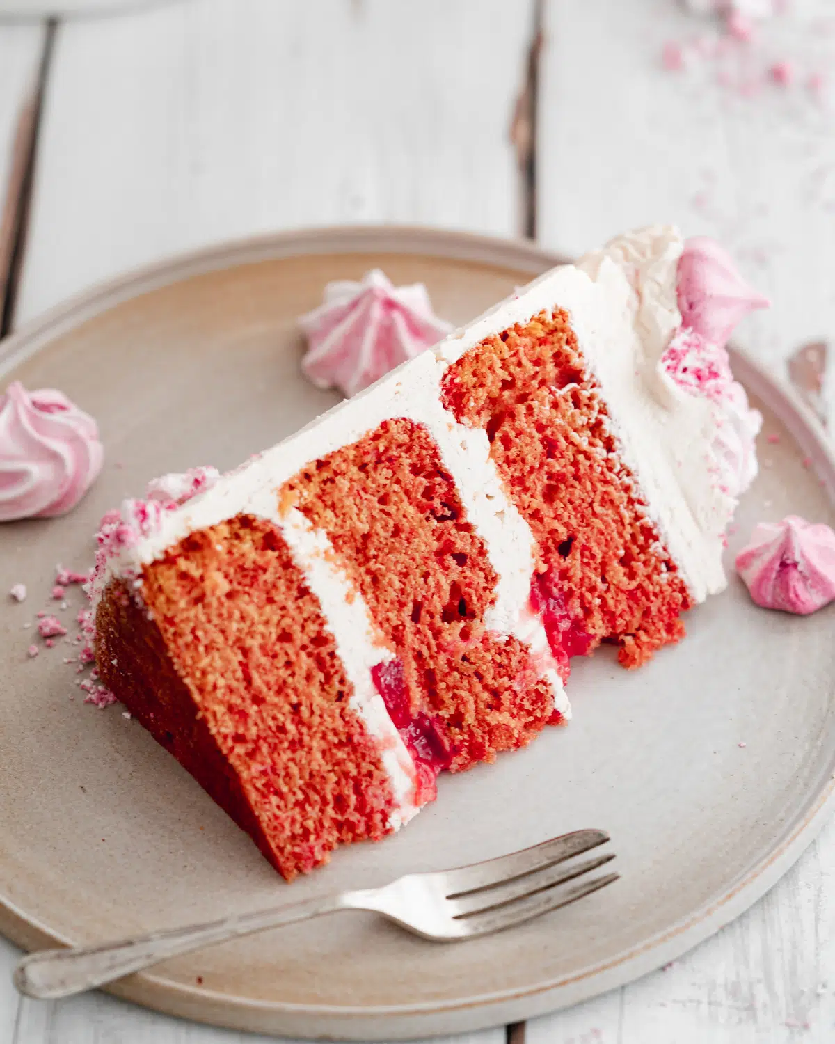 slice of vegan pink champagne layer cake.