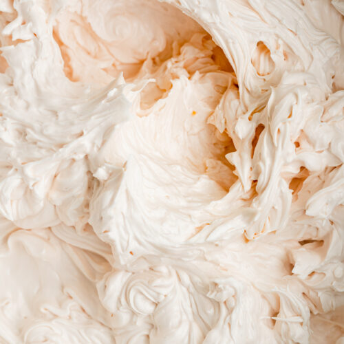 closeup of pink champagne italian meringue buttercream frosting.