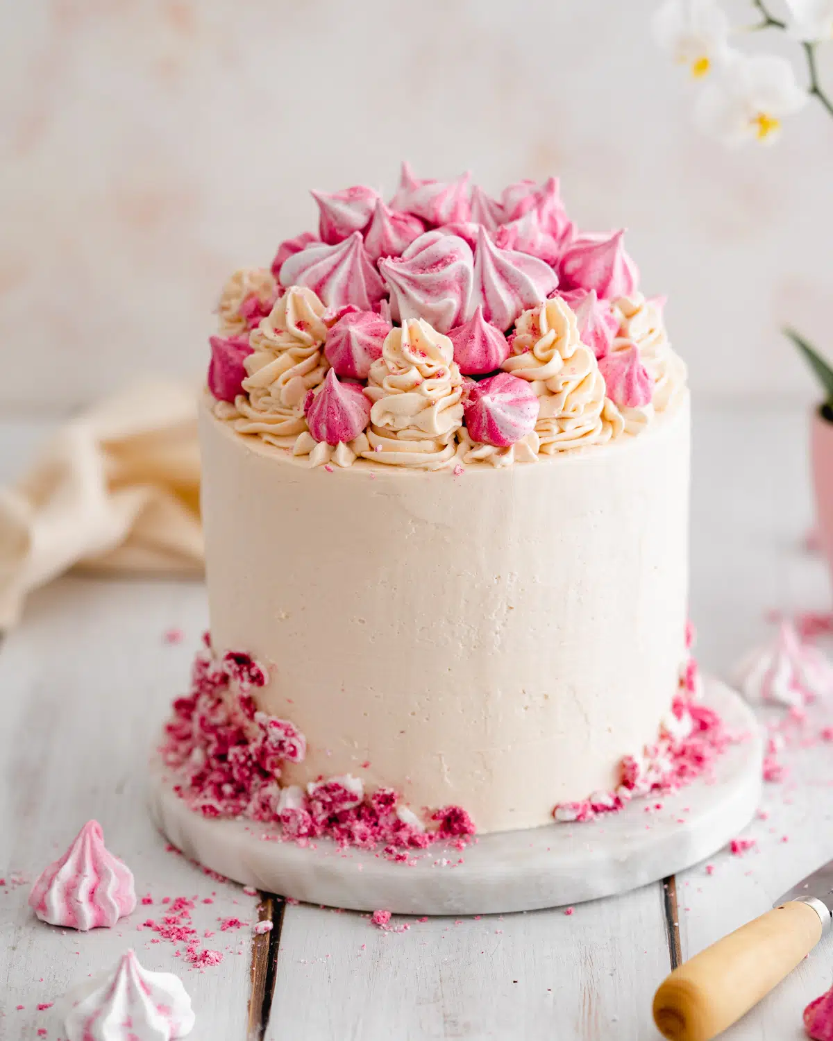 vegan pink champagne cake with italian meringue buttercream.