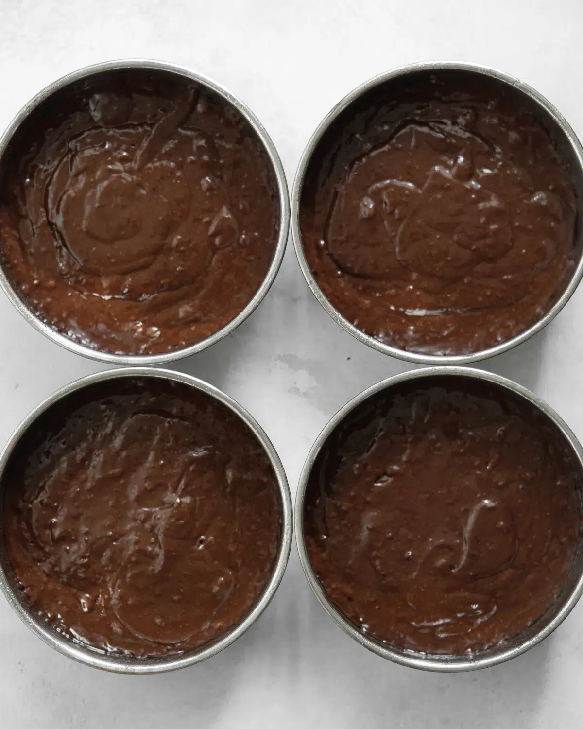 chocolate cake in cake tins.