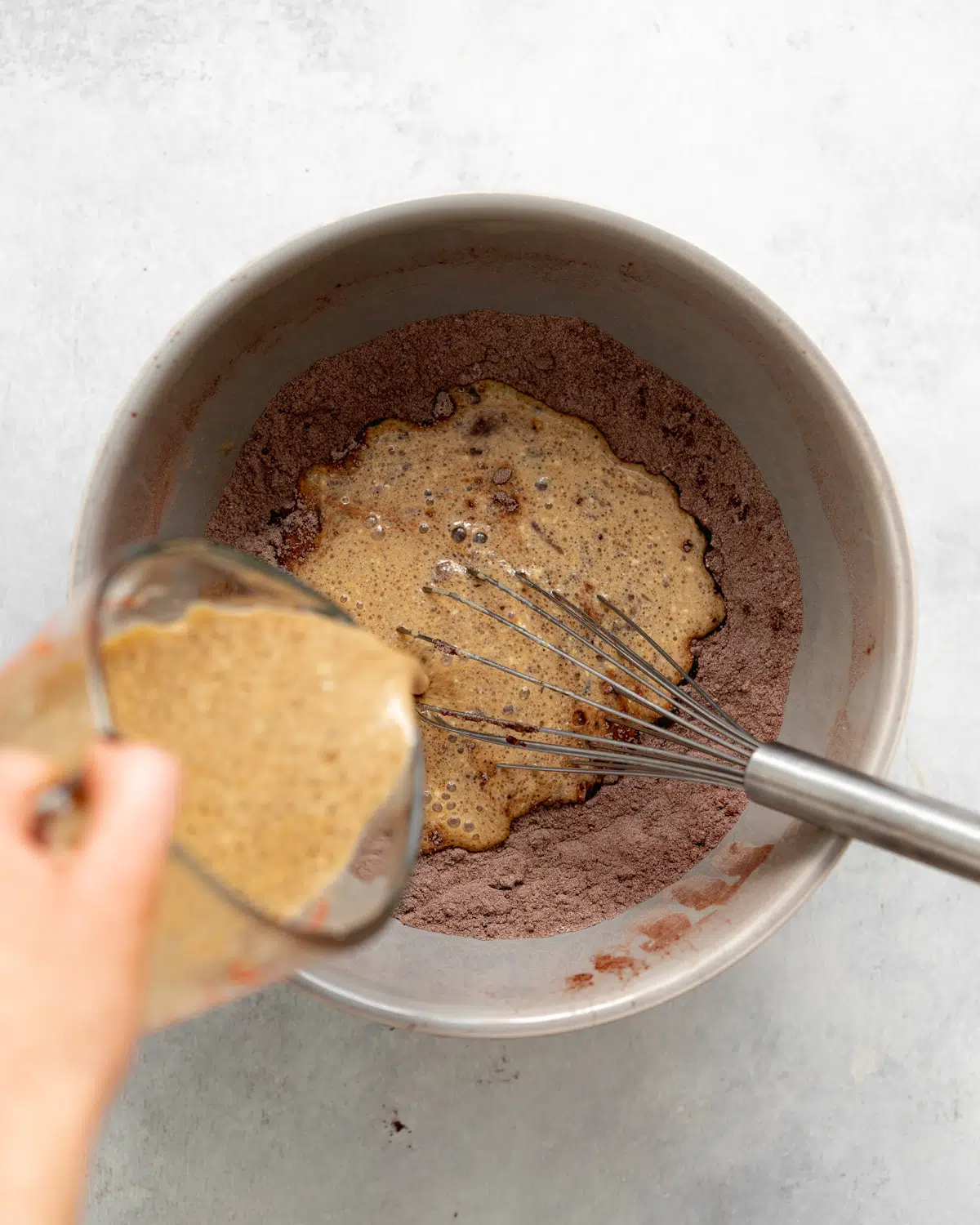 mixing ingredients for vegan blackberry chocolate cupcakes.