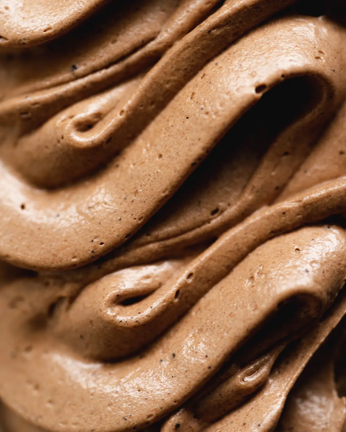 close up of dairy free chocolate frosting.