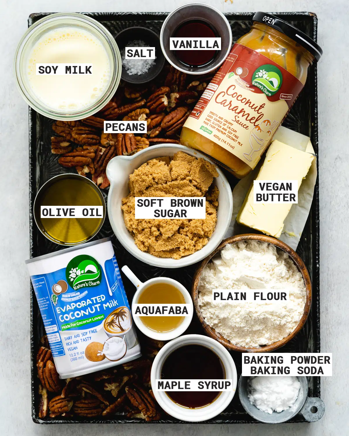 ingredients for vegan pecan cupcakes on a metal tray.