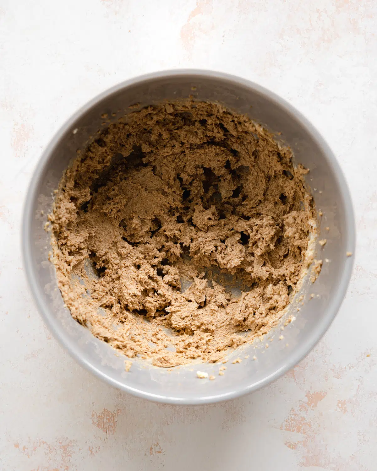 ingredients for speculaas creamed together in a bowl.