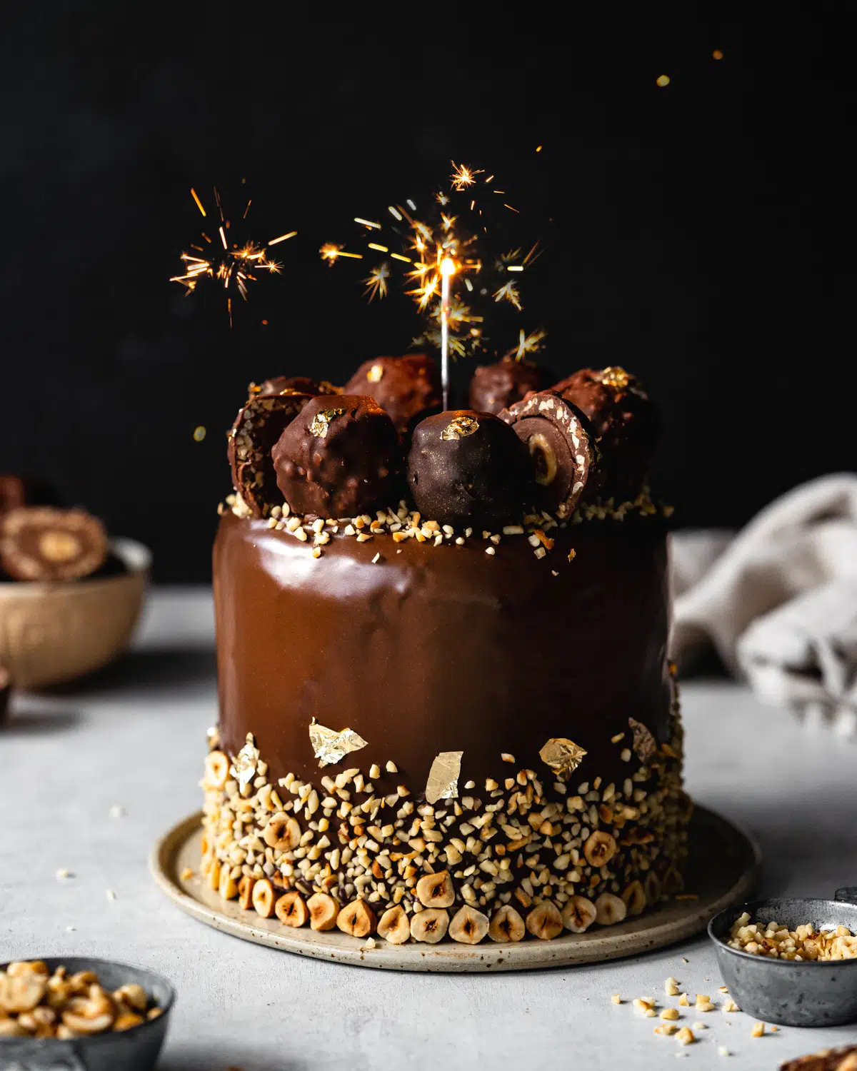 chocolate hazelnut cake with ferrero rocher and sparklers.