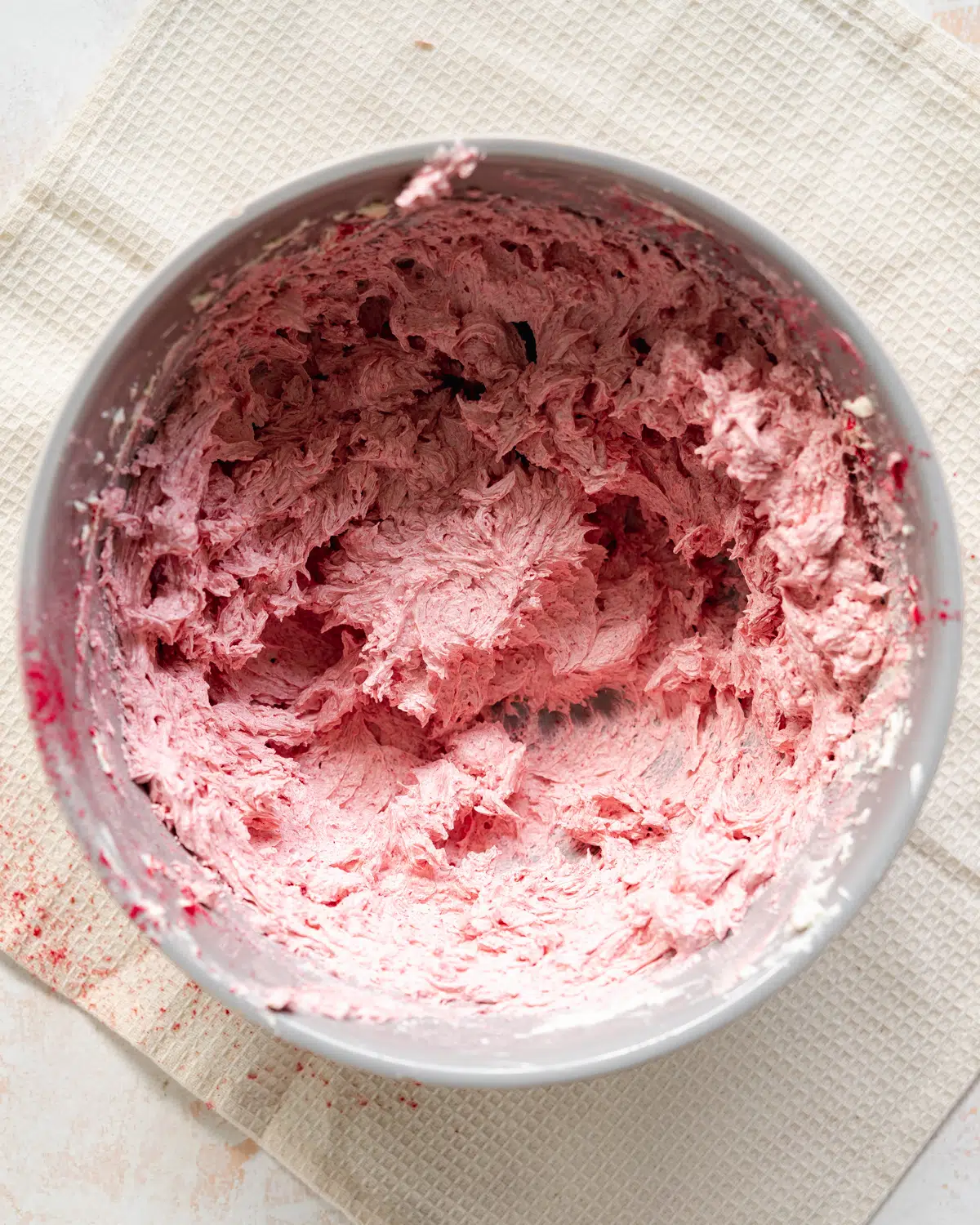 vegan raspberry swiss meringue buttercream in a bowl.