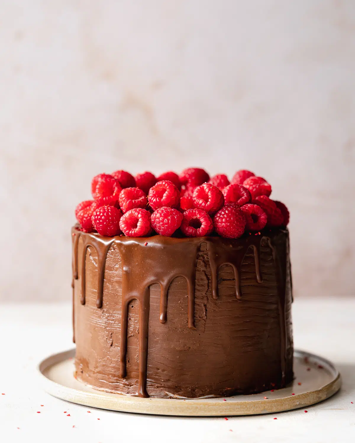vegan raspberry chocolate drip cake.