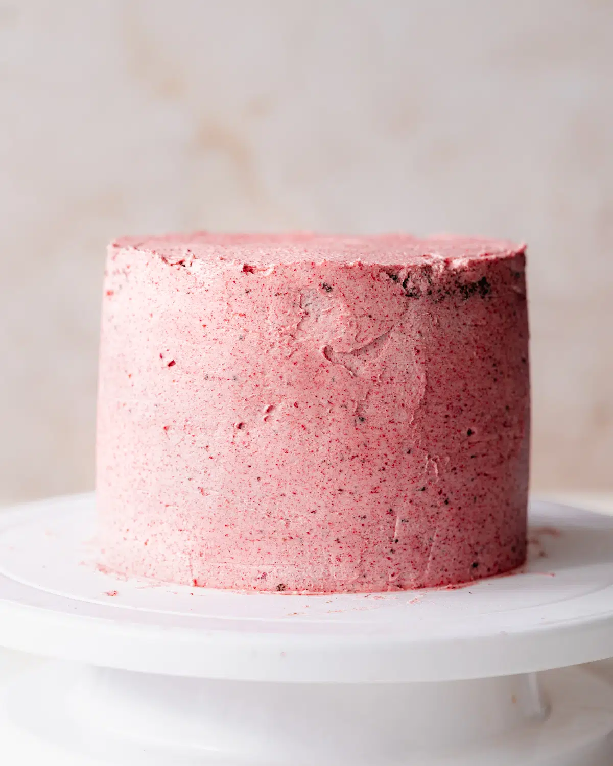 cake covered in raspberry buttercream.