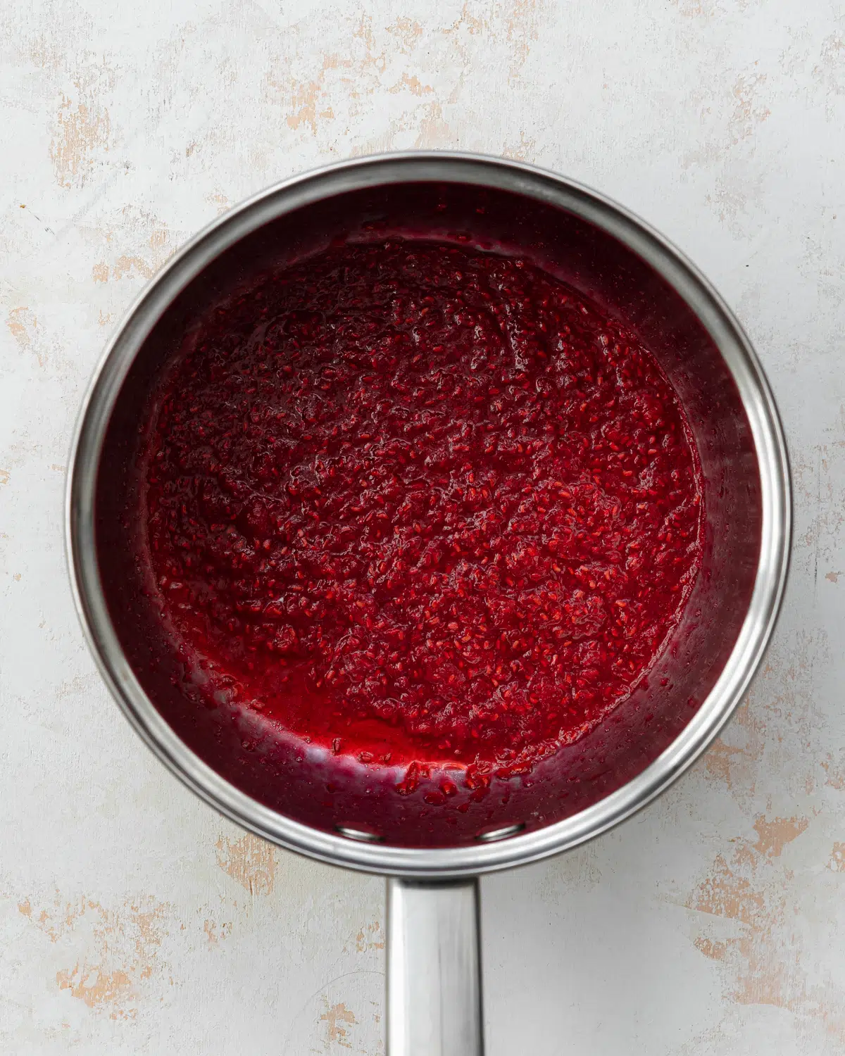 raspberry coulis in a saucepan.