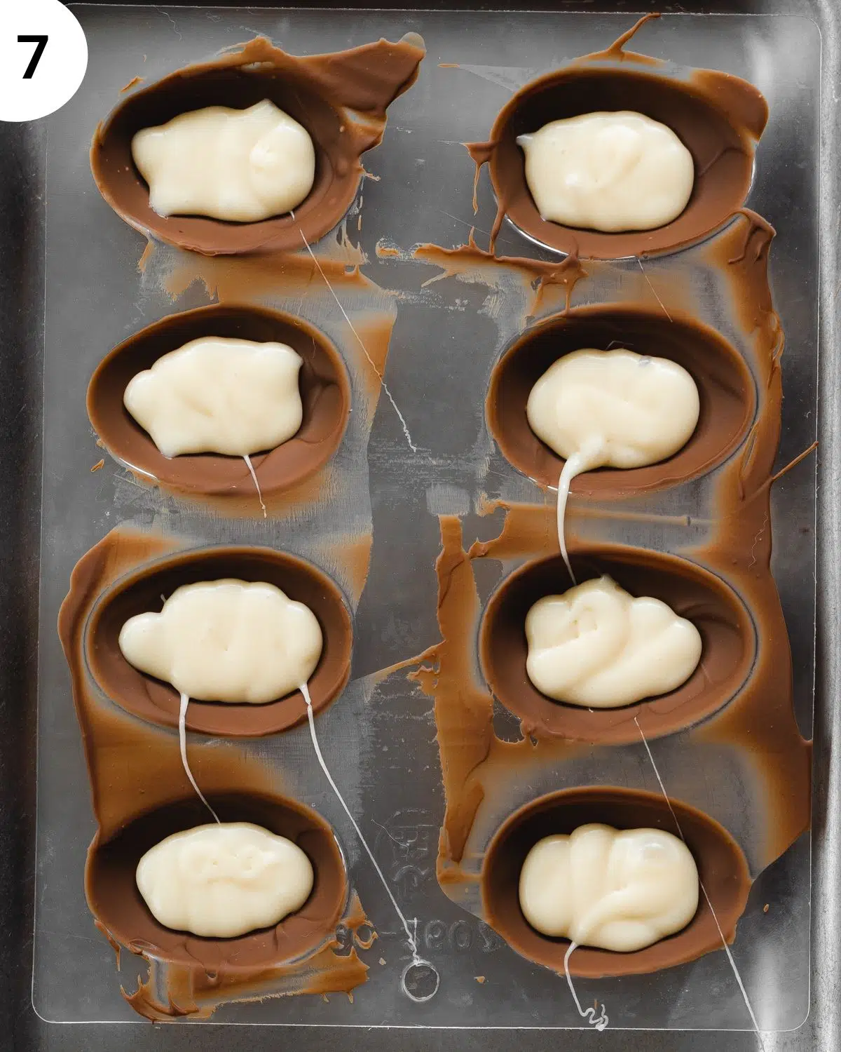 filled creme eggs in an easter egg mold.