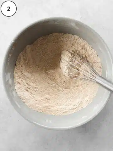 dry cake ingredients in a large bowl with a whisk.