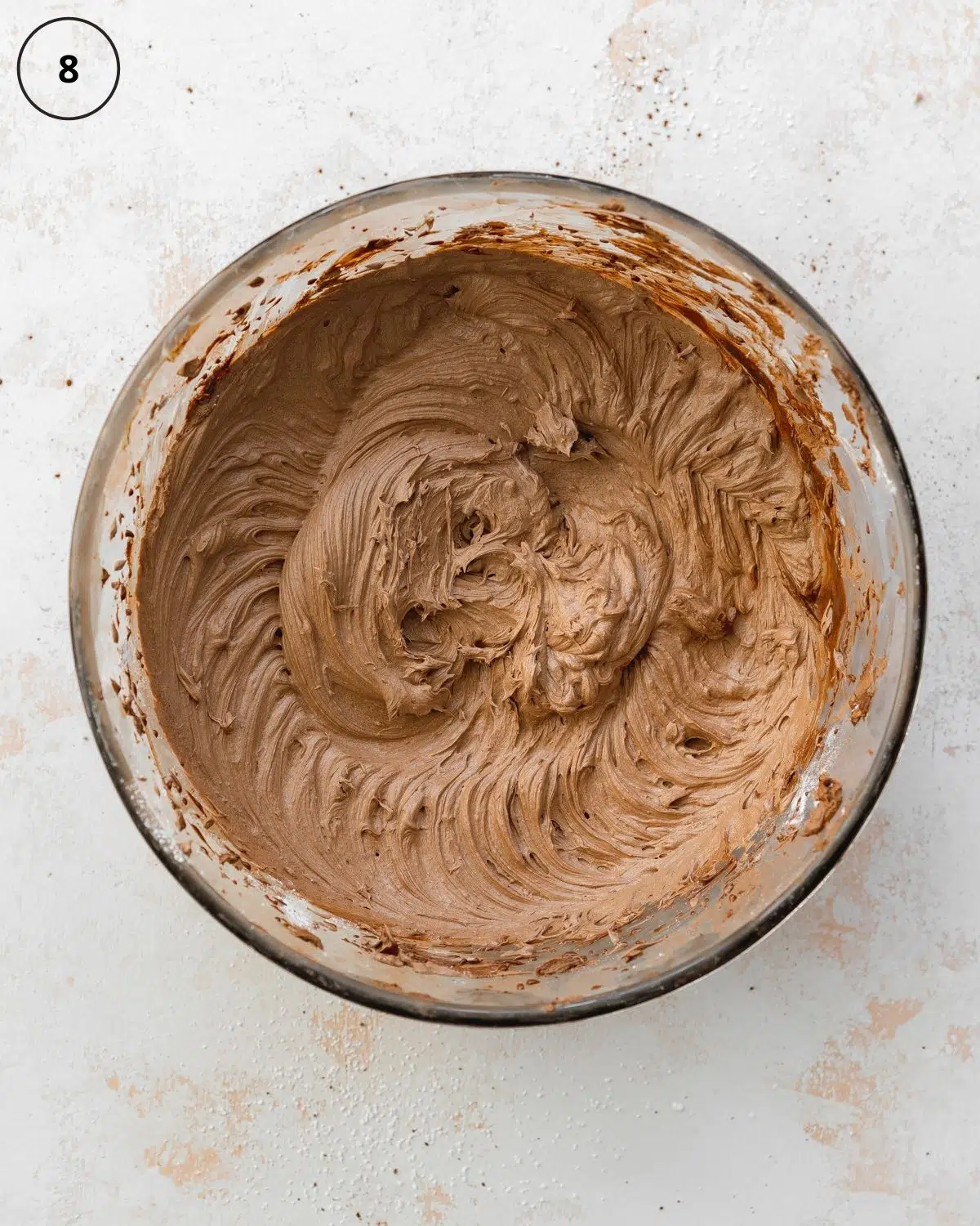 top down view of chocolate whipped buttercream in a bowl.