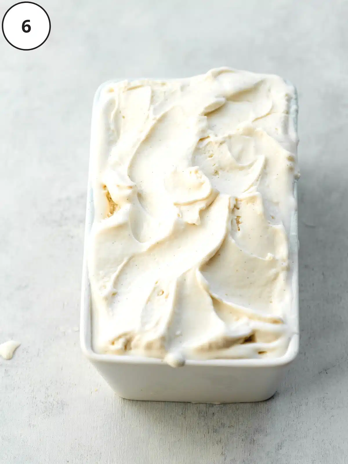 vegan vanilla ice cream in a ceramic tub.
