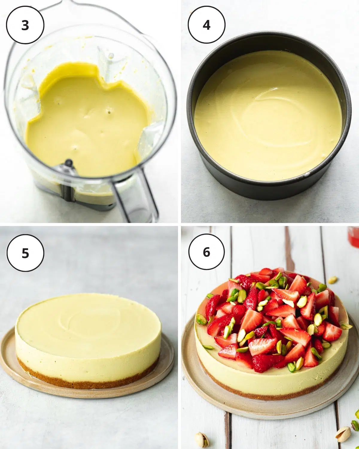 pistachio cheesecake in a blender, in a cake tin, and topped with fresh strawberries.