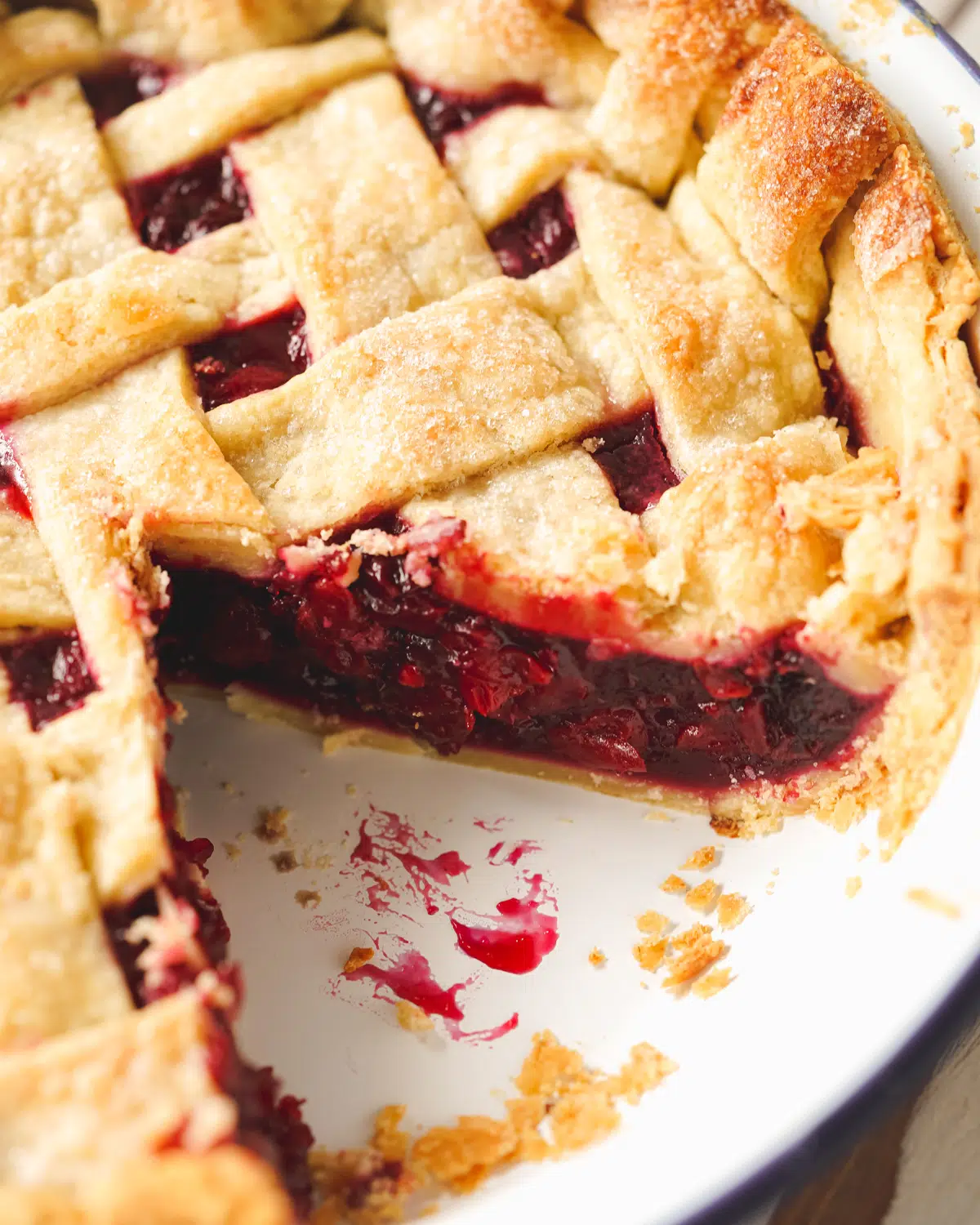 flaky vegan pie crust with cherry pie filling and lattice top.
