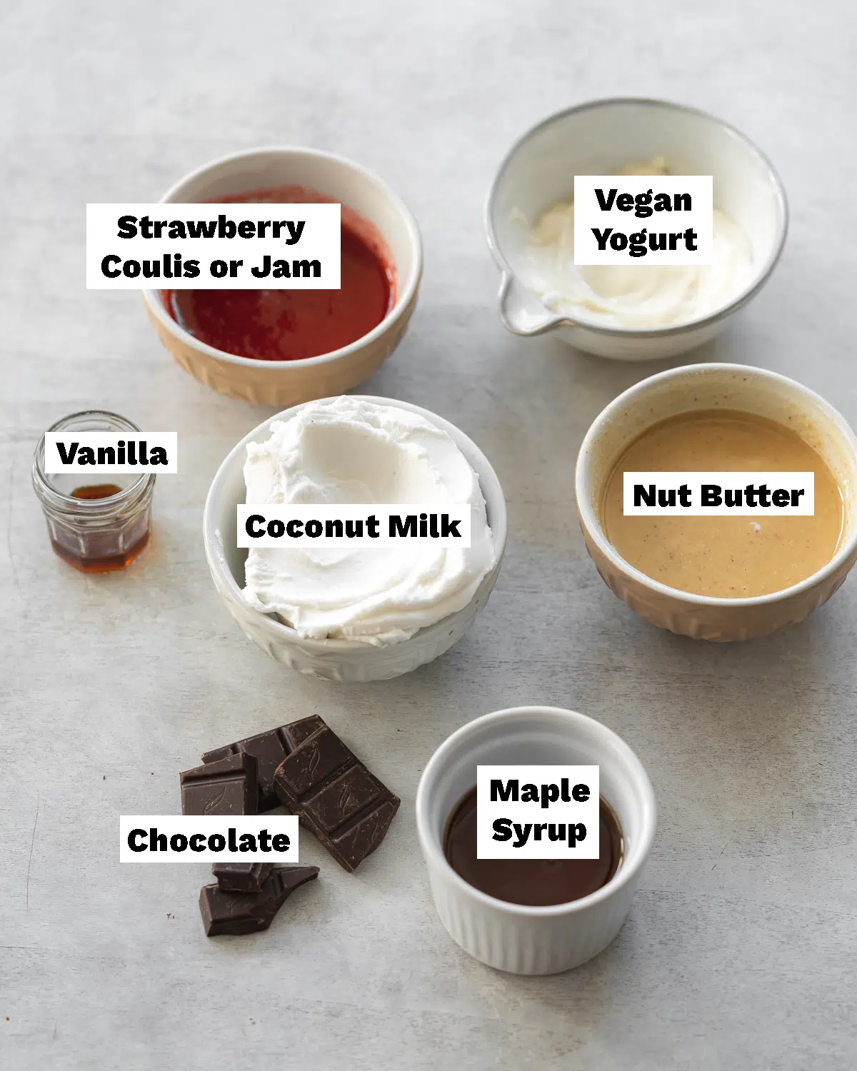 ingredients for vegan magnum ice creams measured out in bowls.