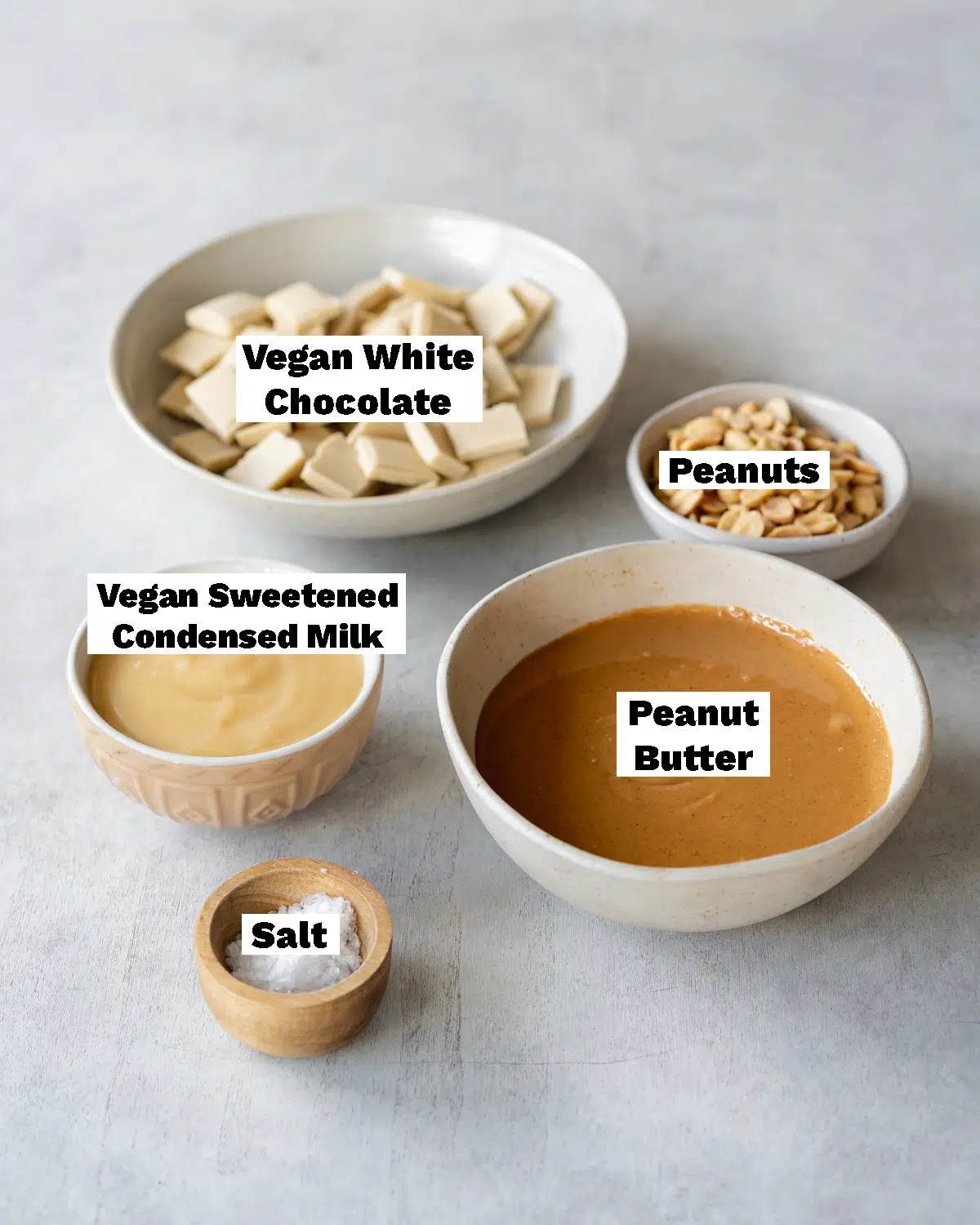 ingredients for making vegan peanut butter fudge measured out in  bowls.