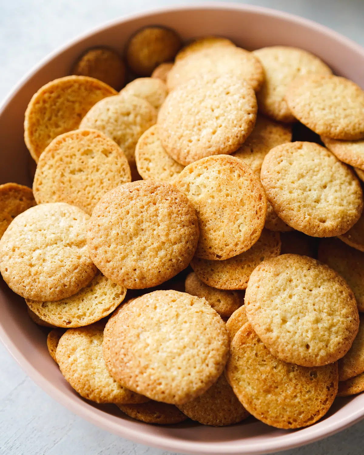 a bowl filled with homemade vanilla wafer cookies.