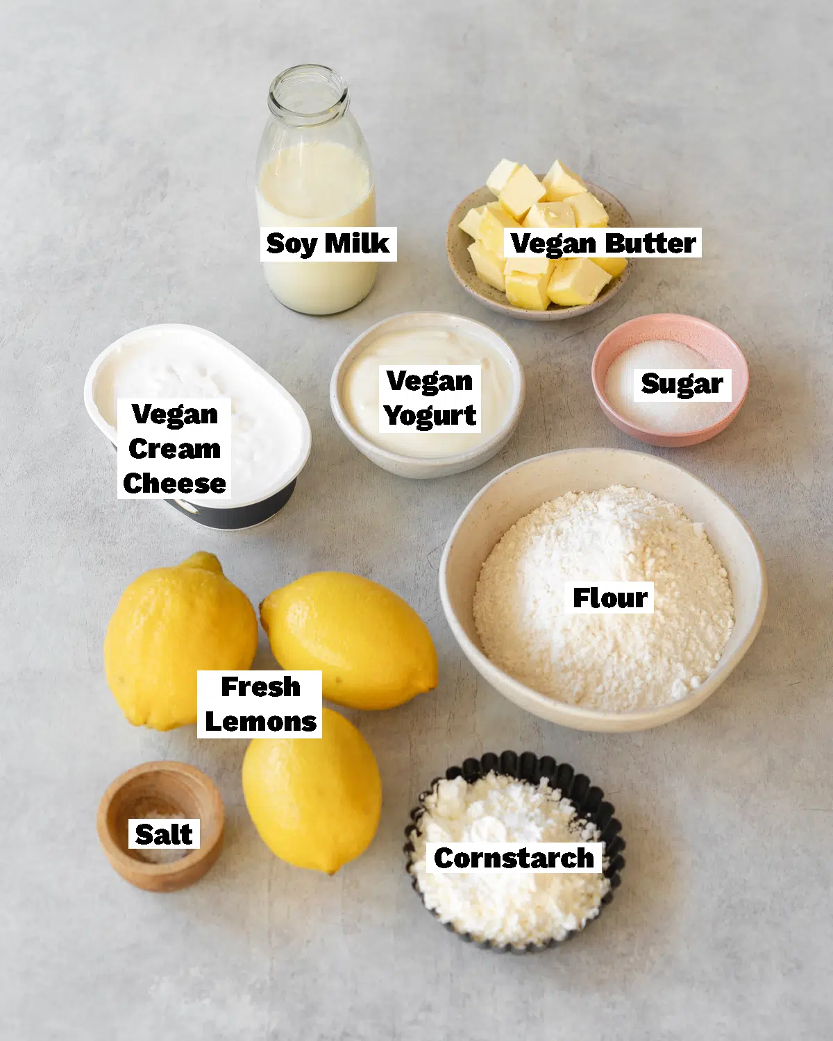 ingredients for vegan lemon pie measured out in small bowls.