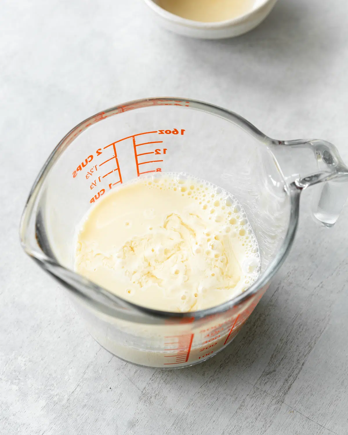 homemade non-dairy buttermilk substitute in a glass measuring jug.