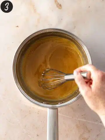 whisking pecan pie caramel filling in a saucepan.