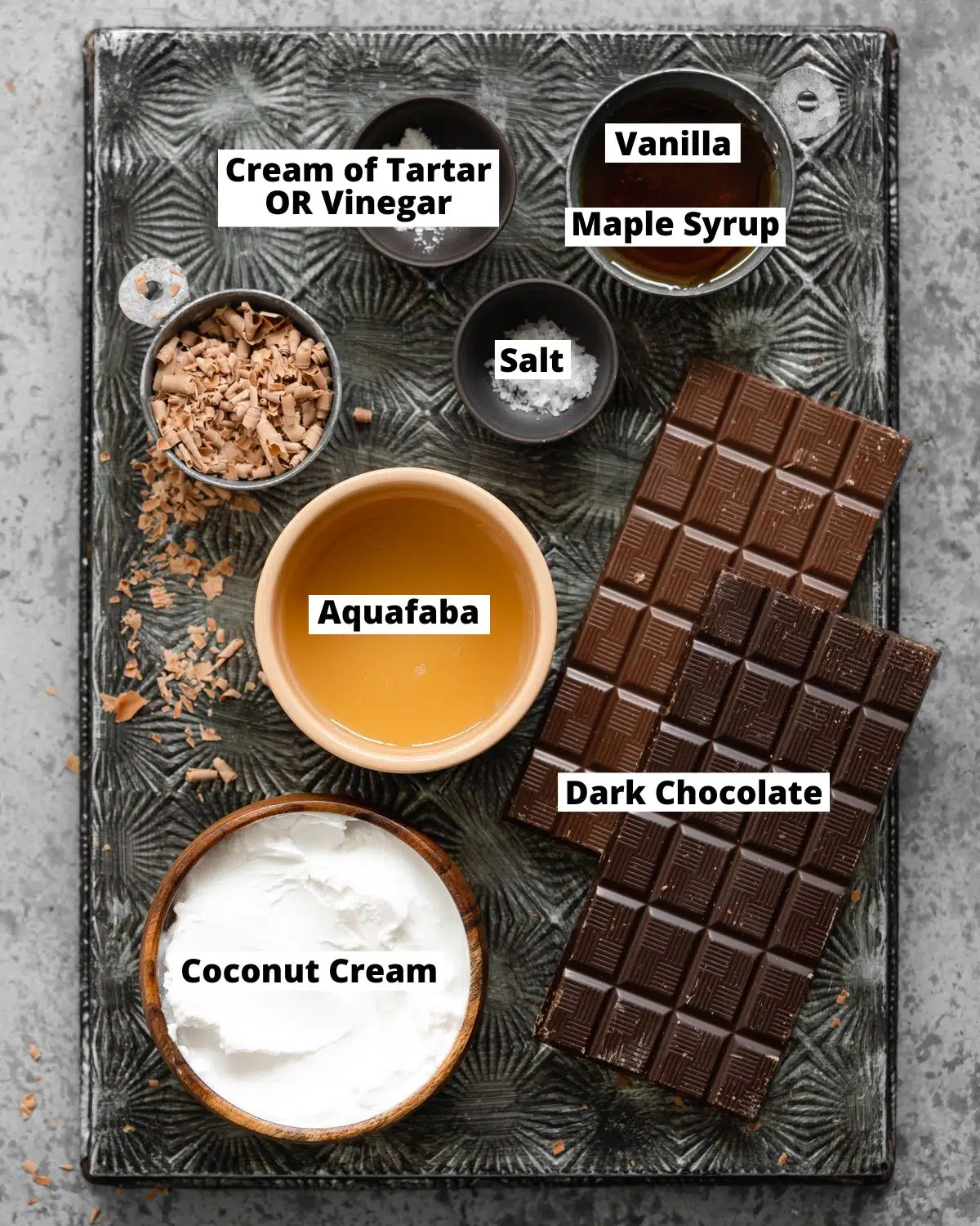 ingredients to make vegan chocolate mousse measured out on a metal tray.