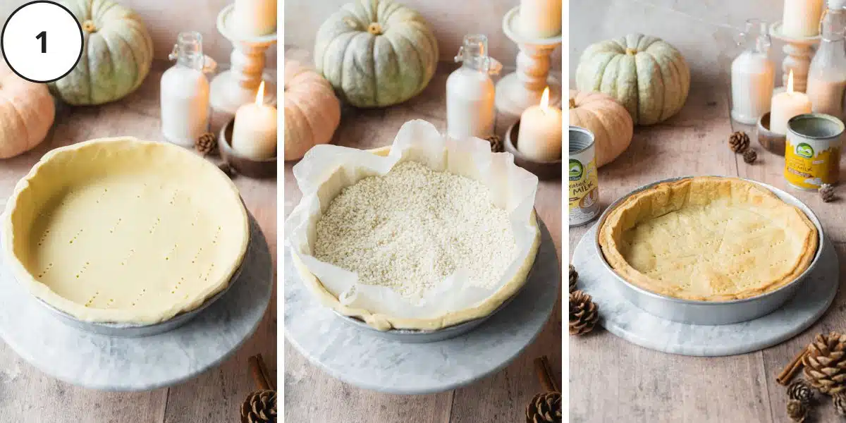 pie crust in a pastry tin with pumpkins scattered around it.