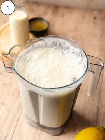 ingredients for vegan ricotta cheese blended together in a vitamix blender jug.