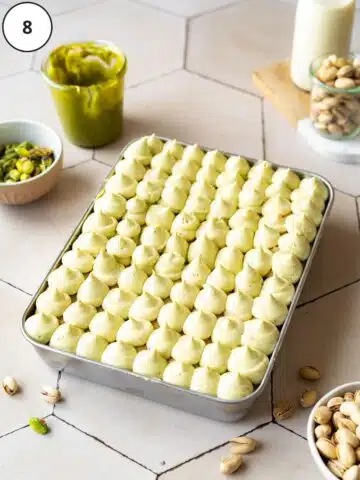 vegan pistachio tiramisu with pistachio mascarpone piped in a layer on top.