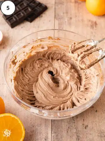 Cacao powder and orange zest added to the cheesecake filling mixture.