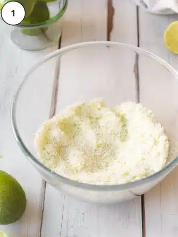 Lime zest and sugar rubbed together in a small mixing bowl.