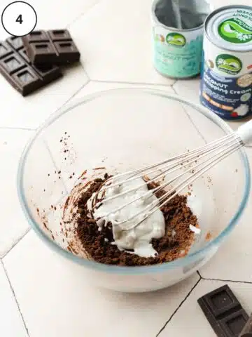 cocoa powder, espresso, and coconut milk in a large mixing bowl with a whisk.